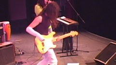 V.J. playing a Fender Strat